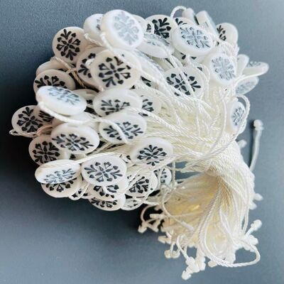 Casual Plastic Tag Fastener Featuring Durable Embossed Technic and Care Instructions Wipe With A Soft Cloth Option for Tagging Solutions